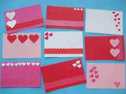 Once the picture is ready to go, cut a hole in the top and the bottom of the fist and insert a. Fun And Easy Valentine Crafts For Kids