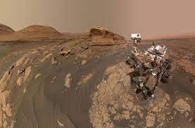 The surface and mountains on mars, with the sky. Mars Photos Show Ingenuity Helicopter S Legs Curiosity Rover S Selfie