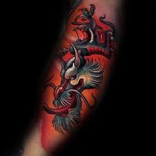 Cool black tribal dragon tattoo on left forearm 160 Kick Ass Dragon Tattoo Designs To Choose From With Meanings Wild Tattoo Art