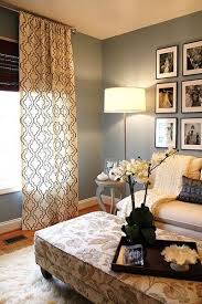 Sage Green Walls White Baseboards Ceiling To Floor Drapes Simple Floor Lamp Symmetrical Uniform Display Of B Photos In Sim Home Home Decor Home Living Room