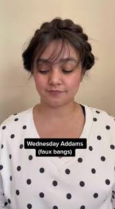 The bangs could have been a little thicker #fauxbangs #wednesdayaddams  #wednesdayaddamshair #braidedhairstyle #hairideas #braidhairstyles  #milkmaidbraids