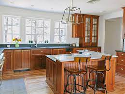 Hole under the wall cabinet and push in the fish tape. How To Run Electricity To Your Kitchen Island This Old House