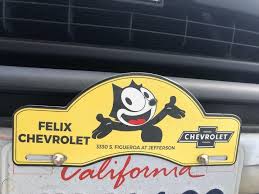 Felix Chevrolet Porcelain Steel License Plate Topper Chevy Gmc Cat Genuine 1928194658