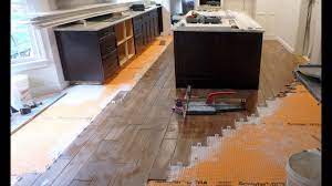 Don't let this discourage you. How To Install Floor Tile Around A Kitchen Island With Wood Look Plank Tile Youtube