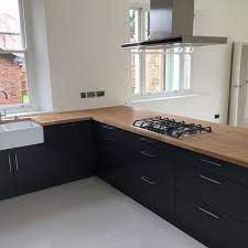 Kitchen interior modern fridge design wall floor house room simple wood wooden apartment architecture basin bright cabinet ceiling light contemporary decor domestic elegance estate fancy fashion faucet flat flooring functional. Gloss Slab The Stamford Kitchen Company