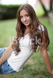Pretty child with dark hair and beautiful face adorably smiles. Junges Teen Stockfotos Freeimages Com