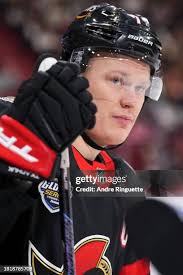 Josh Norris of the Ottawa Senators lifts the stick of Jonas Brodin of...  News Photo