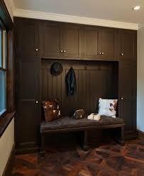 If you get only one furniture item for your foyer, a bench of some sort is probably your best bet. Espresso Mudroom Cabinets Transitional Laundry Room Crown Point Cabinetry