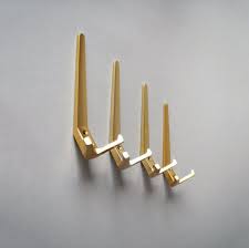 These modern, minimalist coat dots perfectly capture dutch industrial designer hella jongerius's quirky yet functional style. Vintage Coat Hooks Mid Century Modern Gold Golden Coat Hooks Anodized Aluminum Brass Danish Modern Eames Hooks 60s 70s Gold Coat Rack Vintage Coat Rack Brass Wall Hook 60s Retro Furniture