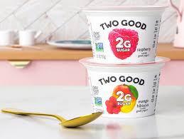 2 g sugar per 5.3 oz. Two Good Greek Lowfat Yogurt Adds Two New Flavors To Its Delicious Portfolio Raspberry Mango Hibiscus Perishable News