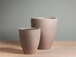 Opt for a plant stand to raise your plants closer to eye. Concrete Planters Modern Lightweight Fiberglass Pots And Planters