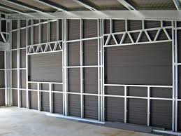 8.door hinge screws exposed because the wall panel opening was cut too large. Stud Frame Wall Great Sheds Done Right Sheds Nz Waikato Sheds Waikato Sheds Lifestyle Sheds Industrial Sheds Habitable Sheds Kitset Sheds Waikato Sheds Hamilton