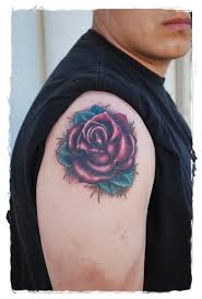 If you hold the view that a single rose flower is quite feminine, you can add some thrones and leaves to stand out your masculinity. Simple Painted Little Red Rose Tattoo On Shoulder Tattooimages Biz