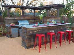 Layered walls perform double duty as both sculpture and a way to define gathering spaces. Small Outdoor Bbq Kitchen Ideas Novocom Top