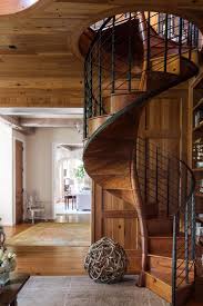 Near The Spiral Stair In This Dallas Home A Hidden Door With Bookshelves Leads To A Closet Staircase Design Stairs Design Wood Staircase