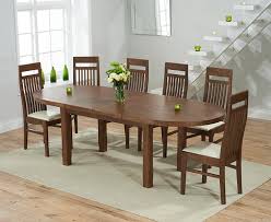 T raditional trestle tables have a bit of an austere reputation. Chelsea Dark Oak Extending Dining Table With Monaco Chairs