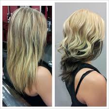 With a messy chignon tied at the top of the head, the hair at the lower back. Blonde Hair Under Black Hair Novocom Top