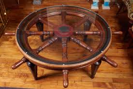 It is connected to a mechanical, electric servo. Antique Ship S Wheel As Coffee Table With Glass Top At 1stdibs