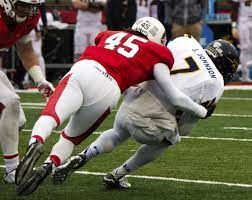 Ball State Freshman Cornerback Lamont Mcphatter Tackles Toledo S Junior Defensive Back Delando Johnson During The Bsu H Homecoming Games Defensive Back Johnson