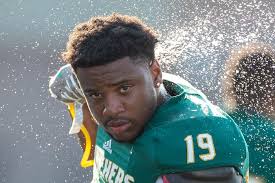 Photos of high school football contest between Bremen and Washington.