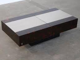 This striking wooden coffee table exudes a rugged charm that will make it a distinctive addition to your living room or bedroom. Vintage Sliding Coffee Table With Liquor Storage By Mahey Maville For Sale At Pamono