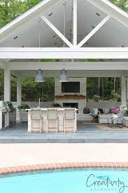 Oxidized woven steel is used to create a textured backdrop to this outdoor kitchen. Outdoor Kitchen And Pool House Project Reveal Outdoor Kitchen Design Layout Outdoor Living Space Design Pool Houses