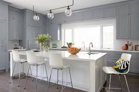 They definitely add an extra expense and aren't always easy to access. Gray Shaker Kitchen With White Island Transitional Kitchen