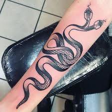 A snake that wraps a lot (actually around the whole arm). Facebook