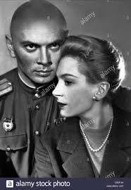 Yul Brynner strolling through Leicester Square in London, March 16, 1959.  The actor was visiting London for the UK premiere of his film, The Journey.  Photo by Terry Disney.