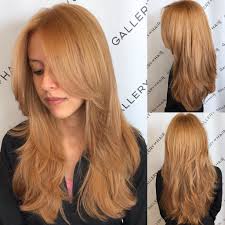 Rake fingers through hair for piecey separation. Golden Strawberry Blonde Shaggy Layered Cut With Center Part The Latest Hairstyles For Men And Women 2020 Hairstyleology