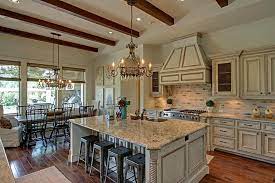 The kitchen island with doors offers stylish french country kitchen workspace, deep closed storage and kitchen stool seating area for guests in your this french country kitchen island complements french country, english cottage, farmhouse, rustic, beach, transitional and traditional style decors. 54 S Player Crest Cir The Woodlands Tx 77382 French Country Kitchen French Country Kitchens French Country Dining