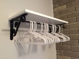 A coat rack on the wall could make the perfect addition. Solution For Bedroom Without A Closet Brackets Board And Cafe Curtain Rod From Lowe S Created A Pl Room Storage Diy Laundry Room Shelves Laundry Room Storage
