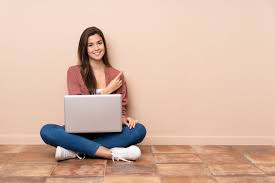Teenager Student Sitting On The Floor With A Laptop Pointing To The Side To Present A Product Paid Affi In 2020 Creative Cloud Adobe Creative Cloud Adobe Creative