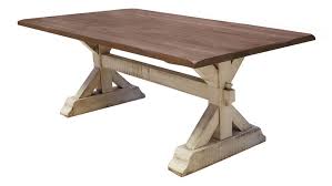 Crafted of rubberwood solids and walnut veneers, this piece features a satin walnut finish, fixed top, and is anchored by a unique architectural style base. Farmhouse Trestle Portabella Dining Table