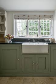 This kitchen might be small, but it makes a big statement. Farmhouse Kitchens For Sussex Surrey The South East Country Kitchen Farmhouse Cottage Kitchens Green Kitchen Cabinets