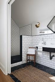Wood effect grey tiles are spot on trend offering the natural wood effect in plank size tiles, perfect for use on your bathroom wall and floor. Black And White Vintage Shower With Black Grid Floor Vintage Bathroom