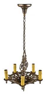 It is an interesting pentagonal shape and holds. Restored American C 1920 1930 Spanish Revival Style Ornamental Polychromatic Metal Five Light Chandelier With Original Ceiling Canopy And Chain