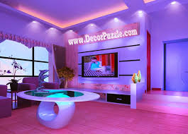 Large formal living room with a nice set of seats, beige walls and a ceiling with exposed beams, lighted by a gorgeous ceiling lighting. Top Ideas For Led Ceiling Lights For False Ceiling Designs