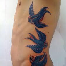 Bird Tattoo On Ribs Men Blue Bird Tattoos Google Search Girl Rib Tattoos Cage Tattoos Rib Tattoos For Guys