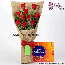 A beautiful mix of roses & lillies flowers in soft shades of yellow & orange, along with palm leaves. Flower And Chocolate Delivery In Delhi Kalpa Florist In Jalandhar Punjab
