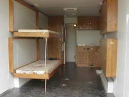 The bunk bed system hangs from the ceiling and has a little ladder to climb up at night. Fold Down Bunks White Cabin Porch Bunk Bed Plans Diy Bunk Bed Bunk Beds