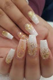 The consistent styling of the black nails is a great steady feature while the angular accents on the white nails add an artistic touch. 23 Best White And Gold Nails To Try Yourself Splenerty