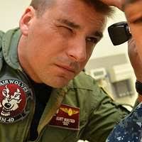 Lt. Patrick Burbano, a flight surgeon with Helicopter Maritime Strike  Squadron (HSM) 46, checks the heartbeat of Lt. Scot Peterson during a  routine physical at Naval Branch Health Clinic (NBHC) Mayport to