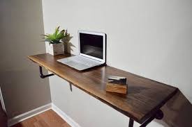 Perfect For Stylish Space Savers This Minimalist Wall Mounted Live Edge Desk With Rounded Edges Is Finished From Ro Wall Mounted Desk Wall Desk Desk Design