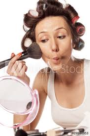 curlers to apply makeup on her cheeks