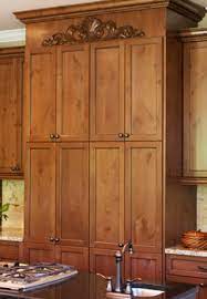 Carved onlays and decorative wood appliques are often used to decorate fireplace mantels, stove or range hoods, and cabinetry headers. Carved Wooden Onlays For Cabinets And Furniture