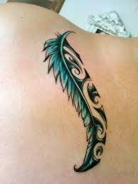 my first tattoo a feather with the maori koru design the koru symbolizes new beginnings growth strength and peace tattoos maori tattoo celtic tattoos