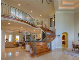 Oak and white stairs by pinterest replacing the banisters are a great option to update your staircase. Consultation Advice Overbearing Wood Stairs A Huge Entry Hall And Living Room Paint Color Designed
