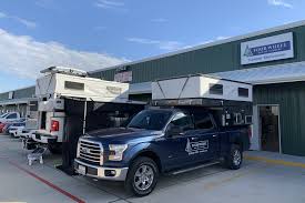Pop up campers, also known as folding campers, are compact units that feature canvas sides that can be unfolded to reveal additional living space. Four Wheel Campers Opens Dealership In Texas Truck Camper Adventure