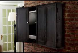 This wall mounted curio cabinet is manufactured from solid wood and comes with two shelves. Wall Mounted Storage Cabinet Ideas On Foter